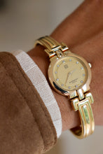 Load image into Gallery viewer, Rare Vintage Givenchy 1990s Gold Round Dial Bangle Watch with crystals