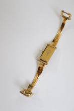 Load image into Gallery viewer, Vintage Gucci Gold Bangle Watch with black dial