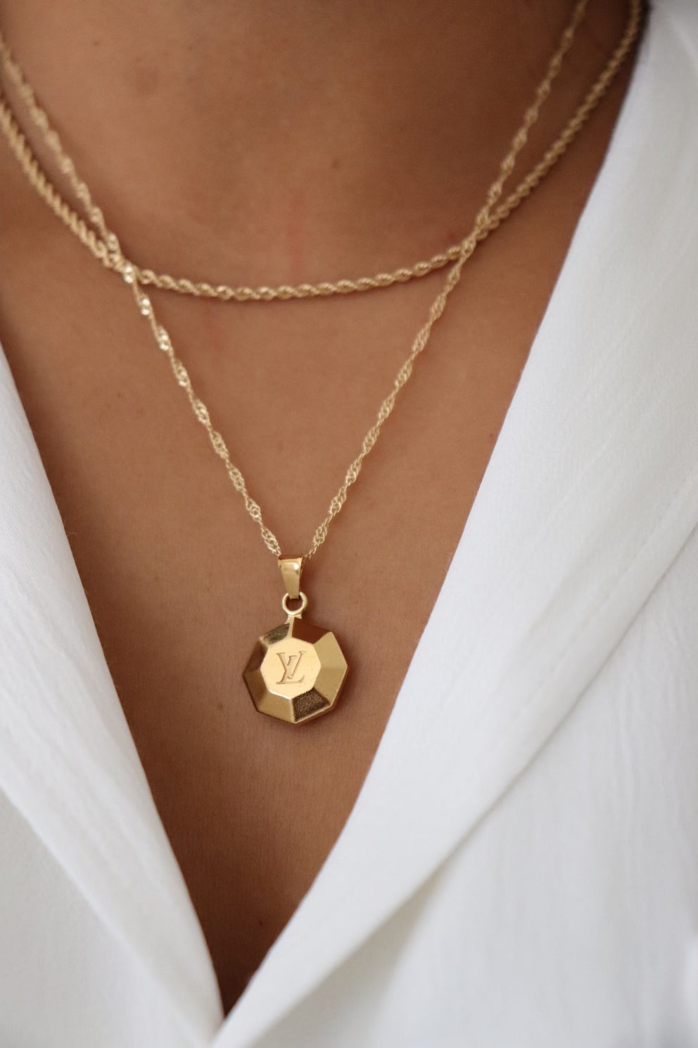 Louis Vuitton octagon golden pendant