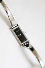 Load image into Gallery viewer, Vintage Gucci Bangle Watch in silver with black dial
