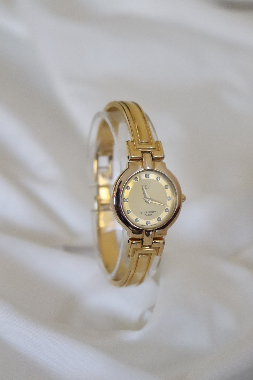 Rare Vintage Givenchy 1990s Gold Round Dial Bangle Watch with crystals