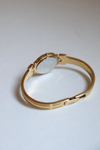 Load image into Gallery viewer, Rare Vintage Givenchy 1990s Gold Round Dial Bangle Watch with crystals
