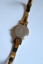 Load image into Gallery viewer, Rare Vintage Givenchy 1990s Gold Round Dial Bangle Watch with crystals
