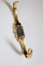 Load image into Gallery viewer, Vintage Givenchy 1990s Black Dial Gold Plated Bangle Watch
