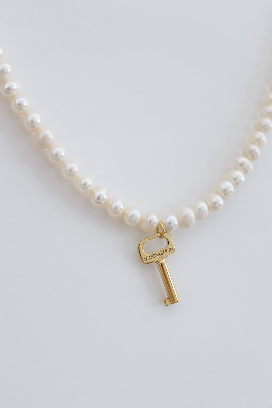 Louis Vuitton key with freshwater pearls