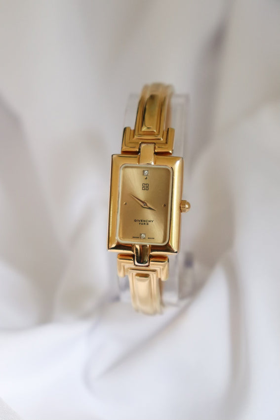 Shop Vintage Givenchy 1990s Gold Dial Gold Plated Bangle Watch